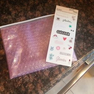 1 Glossier stickers with zip up pink bag